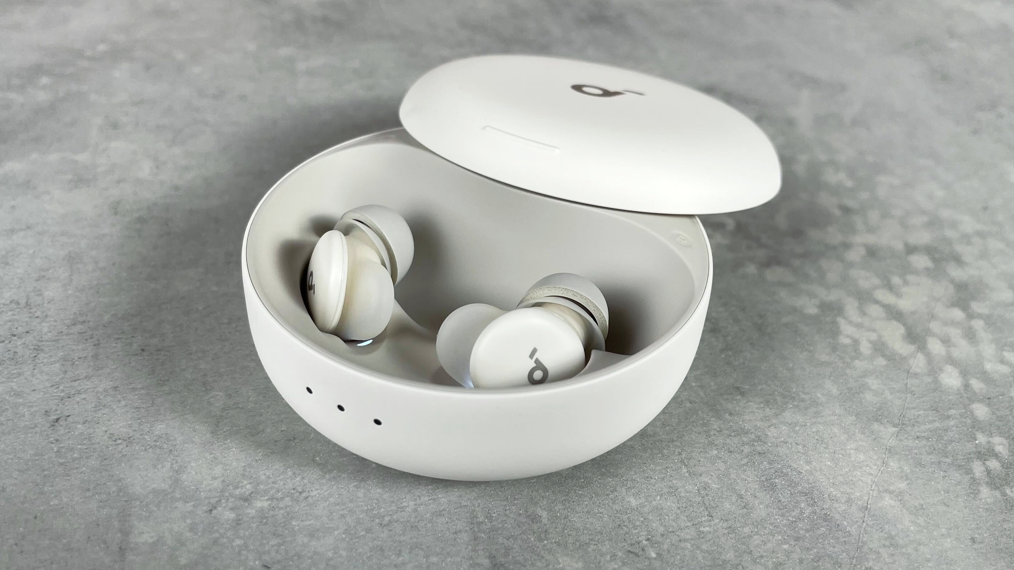 The Soundcore Sleep A30 earbuds are in the open charging case.
