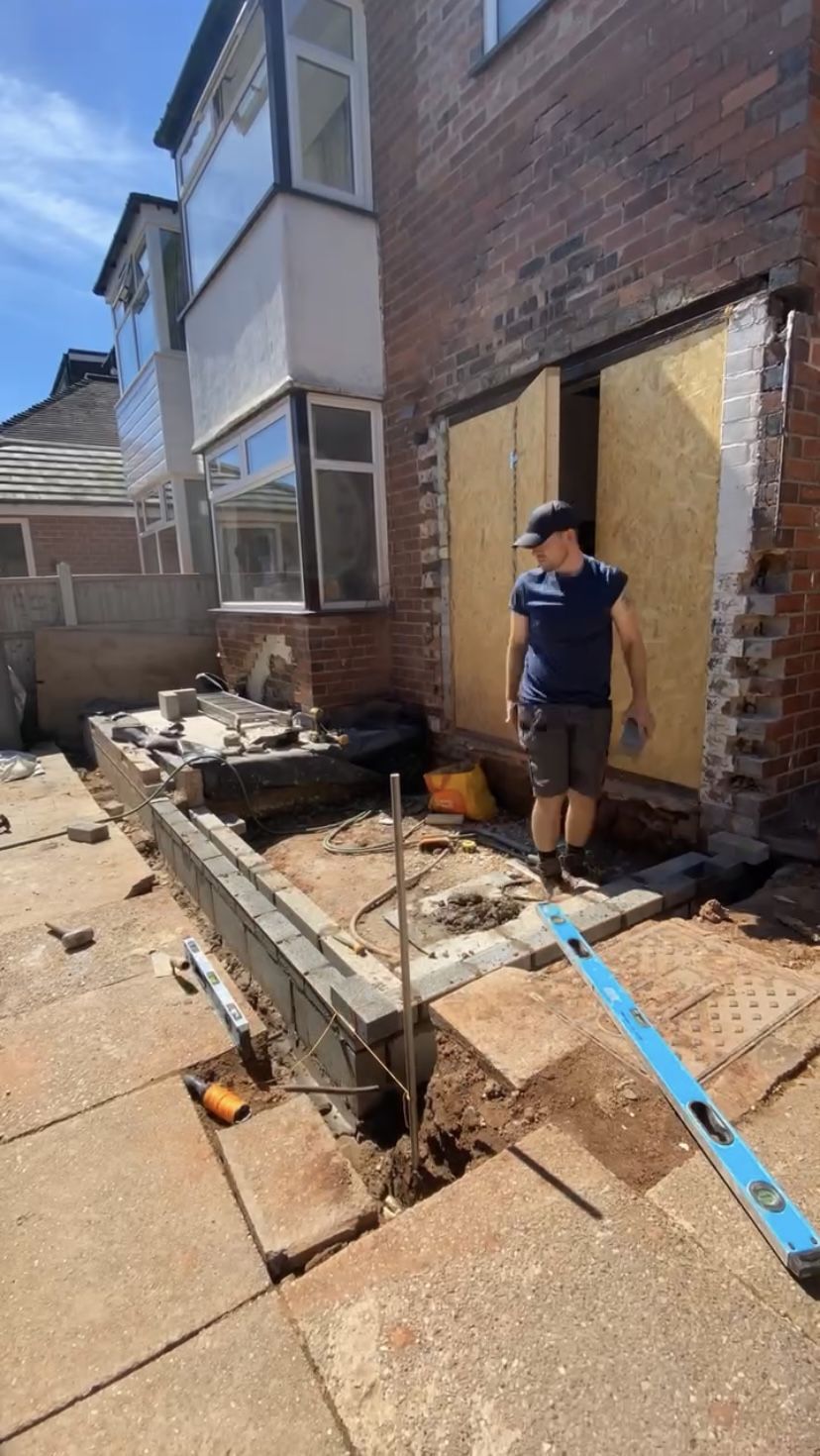 The blockwork being built on the foundations