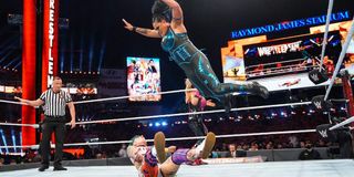 Tamina performing the Superfly Splash onto Ruby Riott at WrestleMania 37