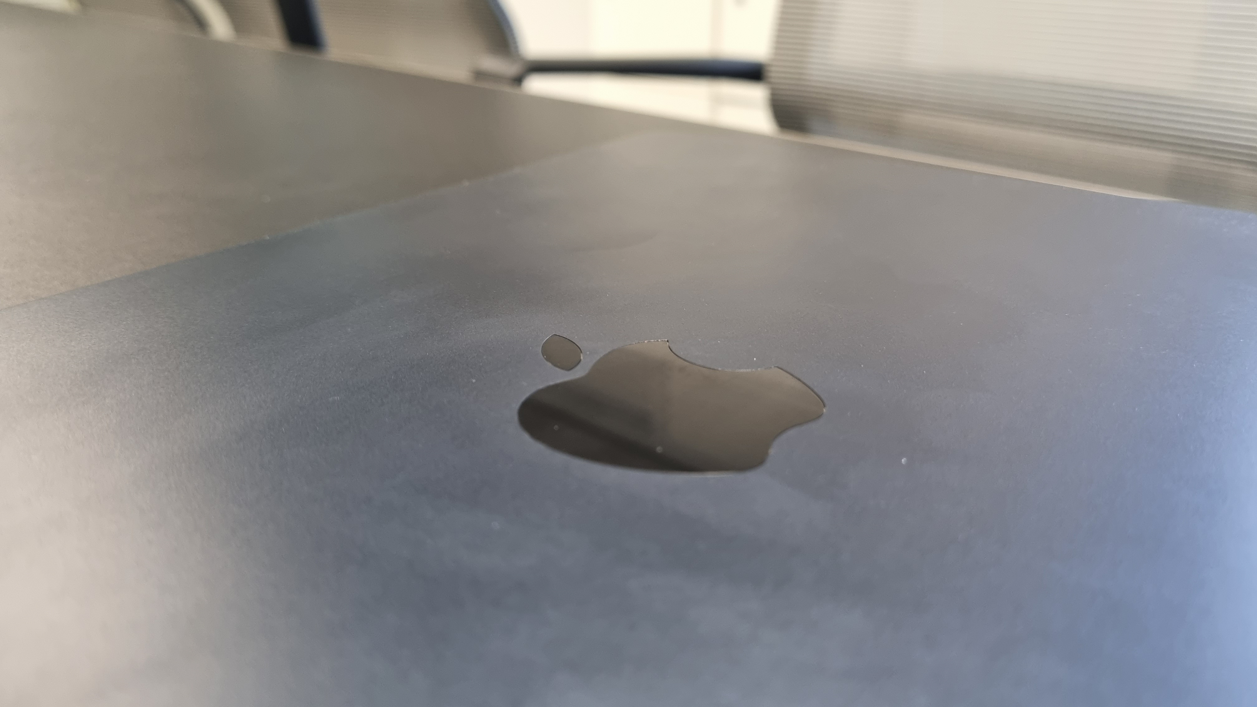 MacBook Air laptop in an office on a black desk