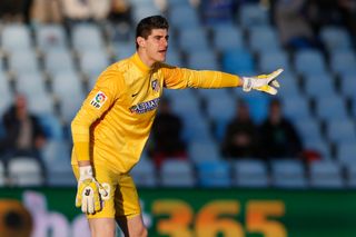 Thibaut Courtois gives orders to his defenders while playing for Atletico Madrid against Getafe, 2013