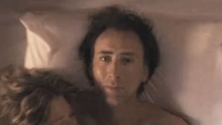 Nicolas Cage lying in bed in Next