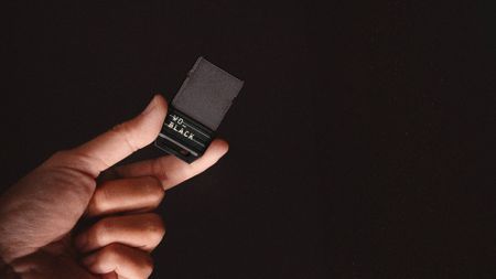 WD_Black C50 being held in front of a black background