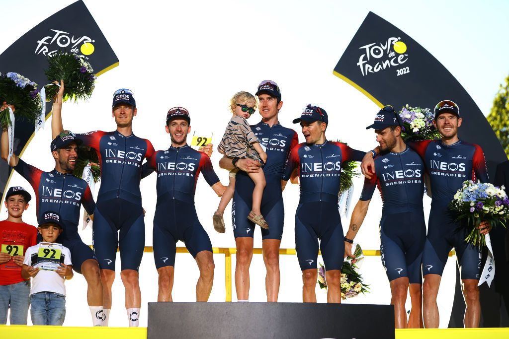 PARIS FRANCE JULY 24 A general view of Jonathan Castroviejo Nicolas of Spain Filippo Ganna of Italy Daniel Felipe Martinez Poveda of Colombia Thomas Pidcock of United Kingdom Luke Rowe of United Kingdom Geraint Thomas of The United Kingdom Dylan Van Baarle of Netherlands Adam Yates of United Kingdom and Team INEOS Grenadiers celebrate winning the best team trophy on the podium ceremony after the 109th Tour de France 2022 Stage 21 a 1156km stage from Paris La Dfense to Paris Champslyses TDF2022 WorldTour on July 24 2022 in Paris France Photo by Michael SteeleGetty Images