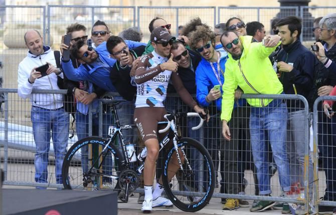 The fans get a chance to take a picture with the riders