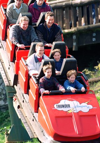 Prince Harry, Prince William, Stephen Davies and Paul Burrell riding a rollercoaster at Alton Towers