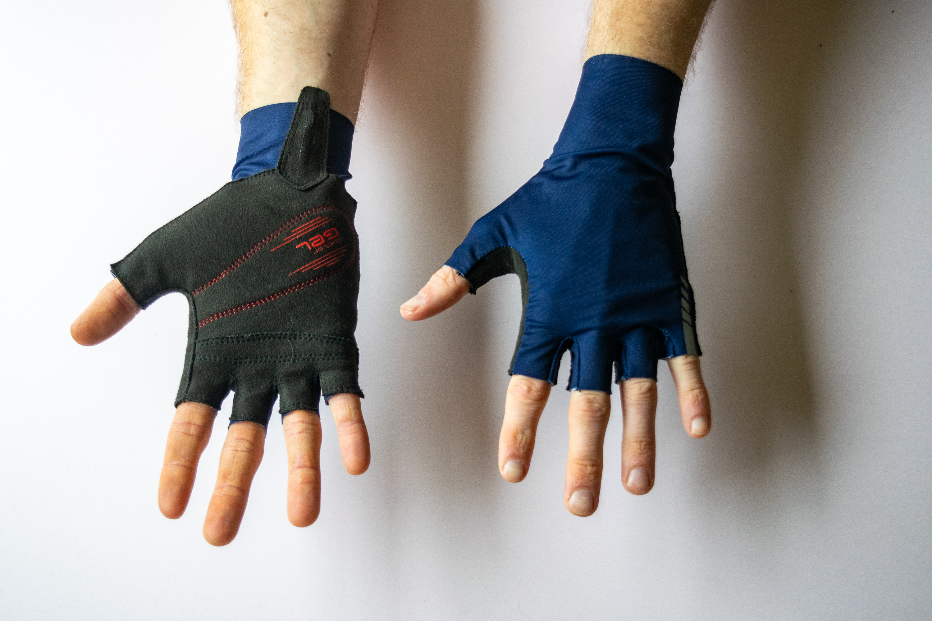 A rider wearing GripGrab Aero TT Raceday Gloves with hands showing the palm and face of the gloves
