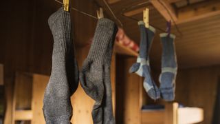 Wet hiking socks hanging up to dry