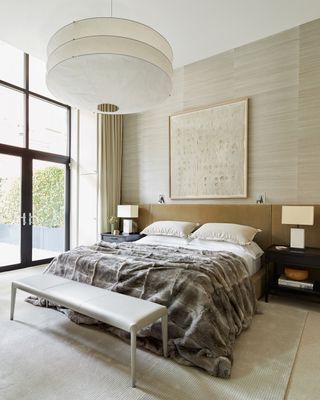 Small master bedroom with elongated headboard