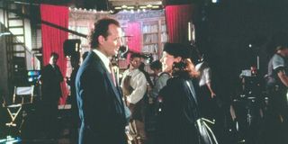 Bill Murray and Karen Allen gazing at each other in Scrooged