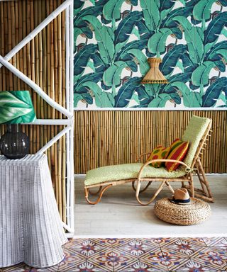 vibrant palm leaf wallpaper with bamboo panelling and lounger