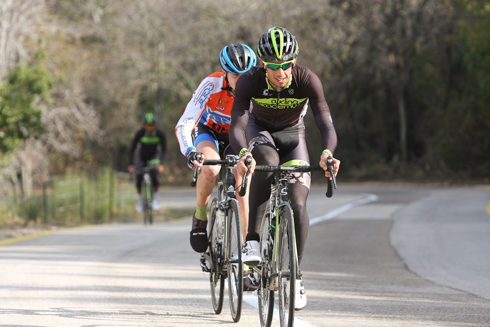 Roy Goldstein leads a development rider up a climb.