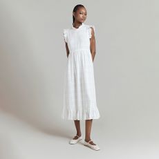 Model wearing a white Ghost dress