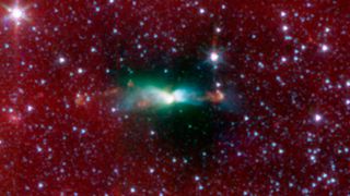 A young protostar in L483 and its outflow as seen by NASA's now-retired Spitzer Space Telescope.