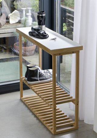 Lagoon console table used as a shoe storage idea