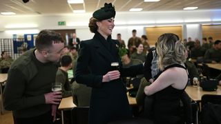 Catherine, Princess of Wales joins Guardsmen and families in the Junior Ranks dining Hall and laughs with them after the 2025 Irish Guards' St. Patrick's Day Parade at Wellington Barracks on March 17, 2025