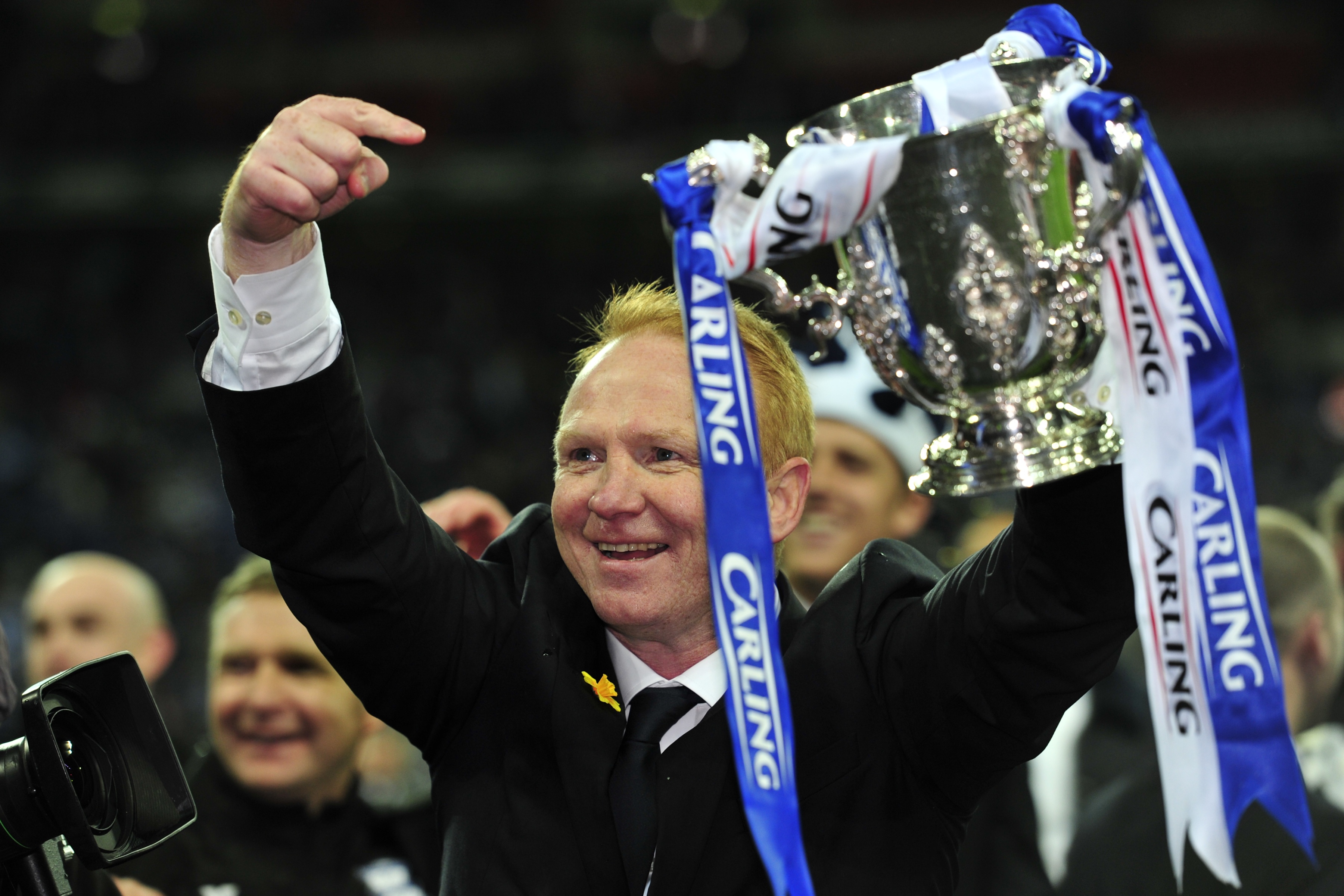 Alex McLeish celebrates with the League Cup trophy after Birmingham City's win over Arsenal in the 2011 final.