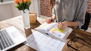 woman writing in diary