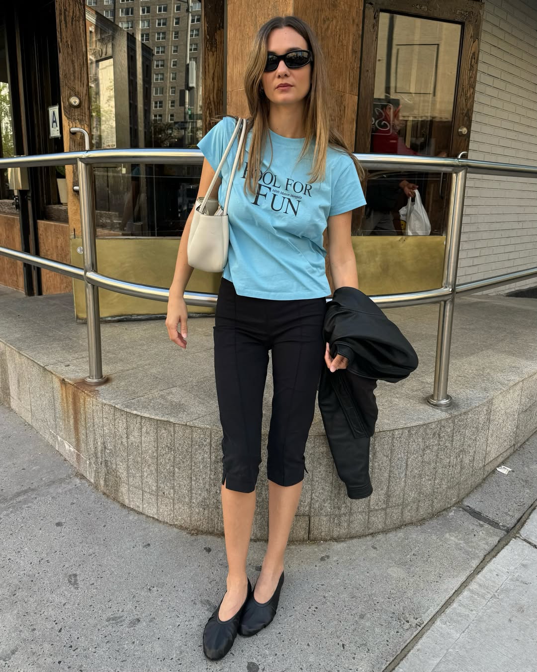annelauremais wears black capri pants and black shoes