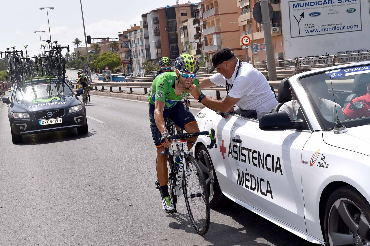 Alejandro Valverde (Movistar) gets checked out after his crash