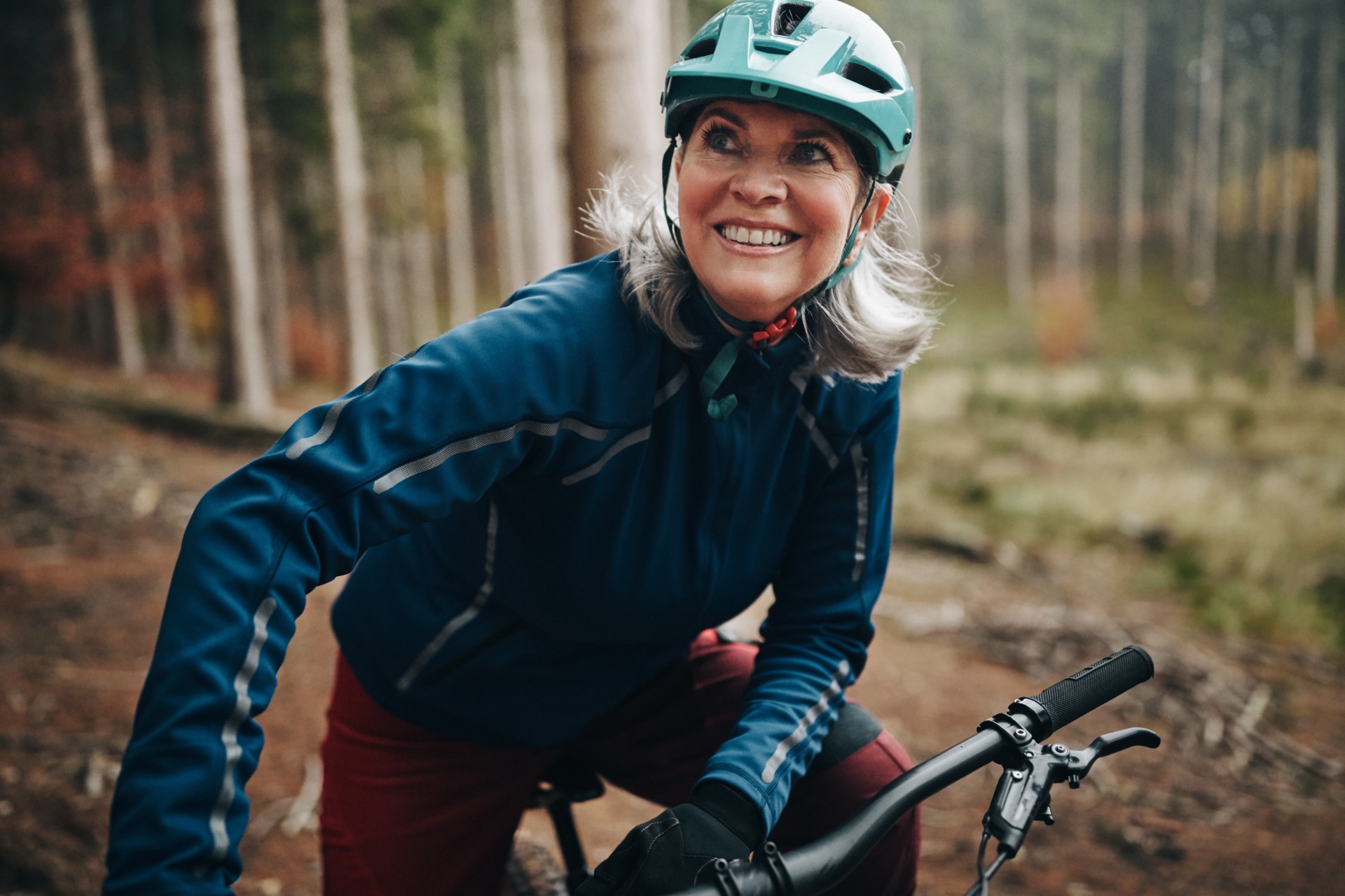 Mature woman taking a break from her mountain bike ride