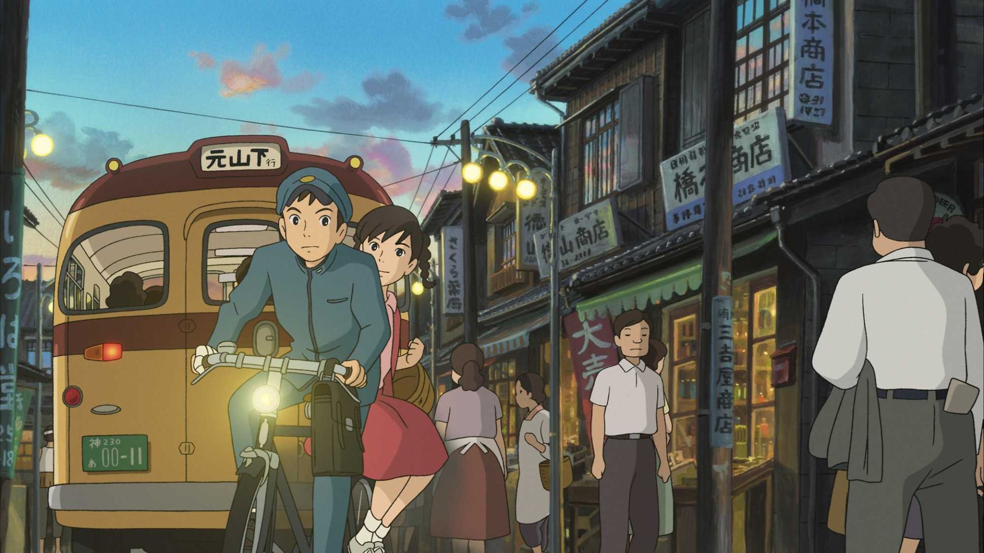 Shun riding his bike through town in From Up on Poppy Hill
