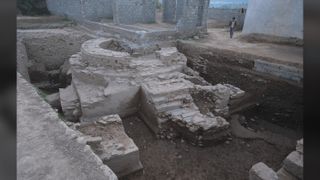 At the center of the ancient temple is a ceremonial platform topped by a cylindrical structure that once housed a stupa – a conical or dome-shaped Buddhist monument.