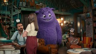 Ryan Reynolds talks to a little girl next a purple creature in 'If'