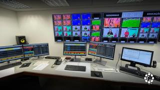 Room with screens and user interfaces for playout technologies.