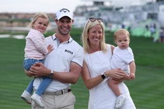 Thomas Detry poses with wife Sarah and his two daughters after winning the 2025 WM Phoenix Open