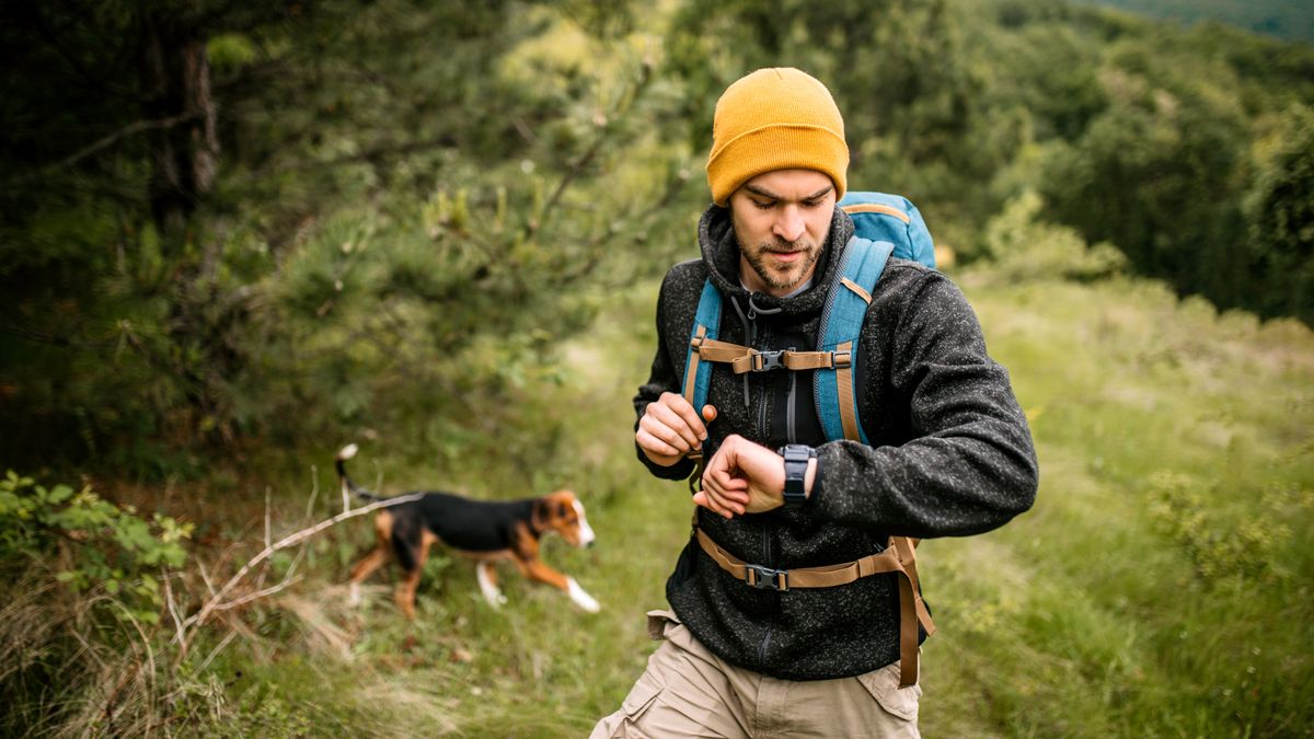 Hiker checking his smartwatch