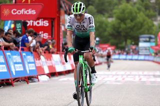 XORRET DE CAT COSTA BLANCA INTERIOR SPAIN SEPTEMBER 02 Jefferson Alveiro Cepeda of Ecuador and Team Caja Rural Seguros RGA crosses the finish line during the 78th Tour of Spain 2023 Stage 8 a 165km stage from Dnia to Xorret de Cat Costa Blanca Interior 905m UCIWT on September 02 2023 in Xorret de Cat Costa Blanca Interior Spain Photo by Alexander HassensteinGetty Images