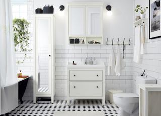 White bathroom storage and washstand with white metro tiles