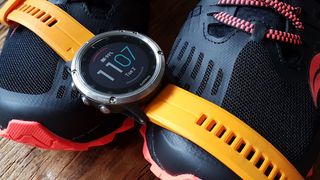 Garmin Fenix 5 Plus watch with orange strap