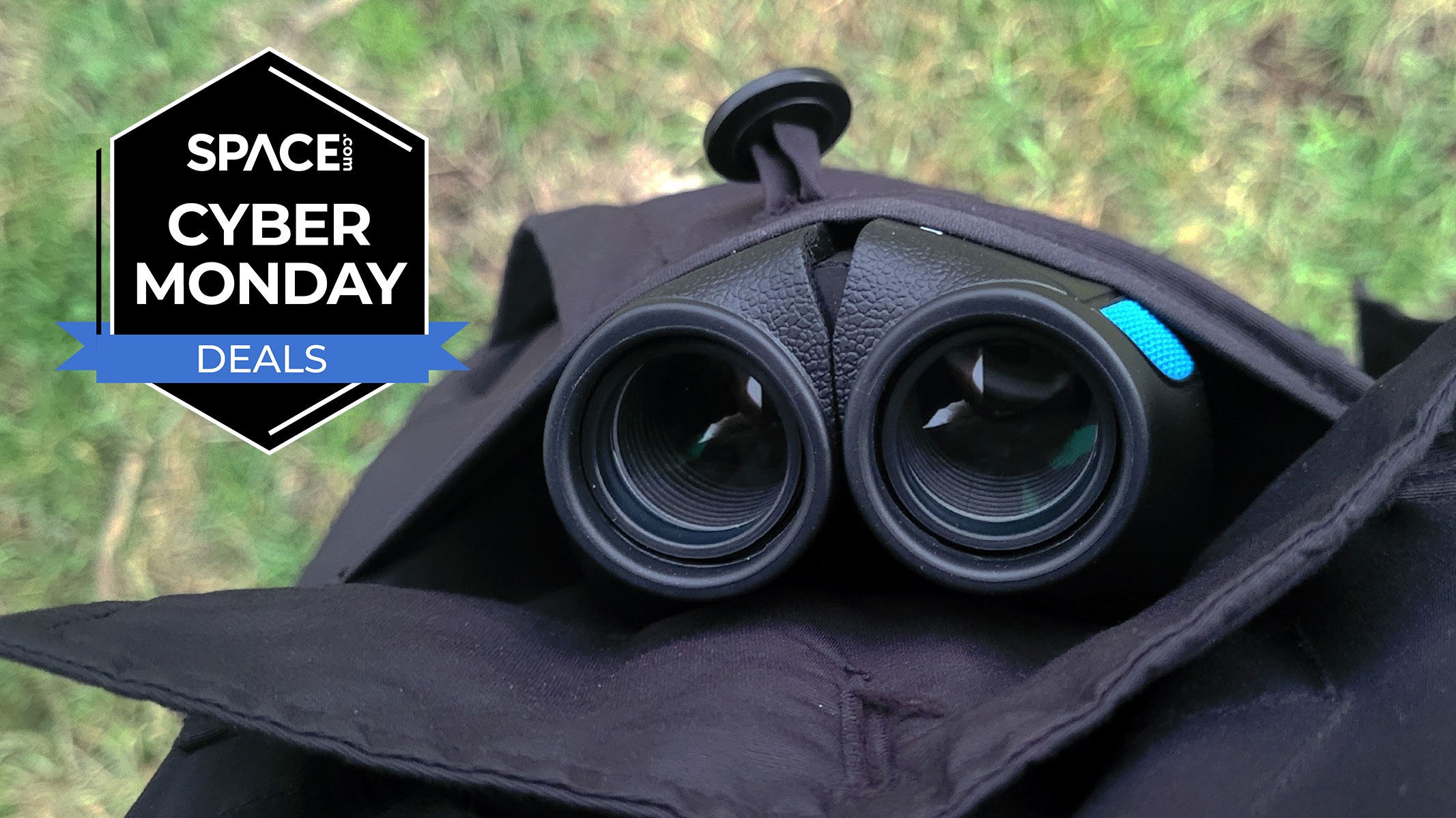 The Occer 12x25 compact binoculars in a black coat pocket with a black Space.com Cyber Monday deals badge in the upper left corner. 