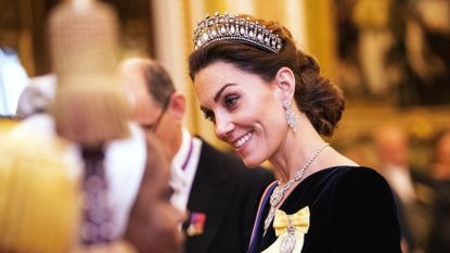 Catherine, duchess of Cambridge talks to guests at an evening reception