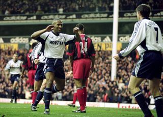 Les Ferdinand celebrates with Tottenham team-mate Darren Anderton after scoring the Premier League's 10,000th goal in a game against Fulham in December 2001.