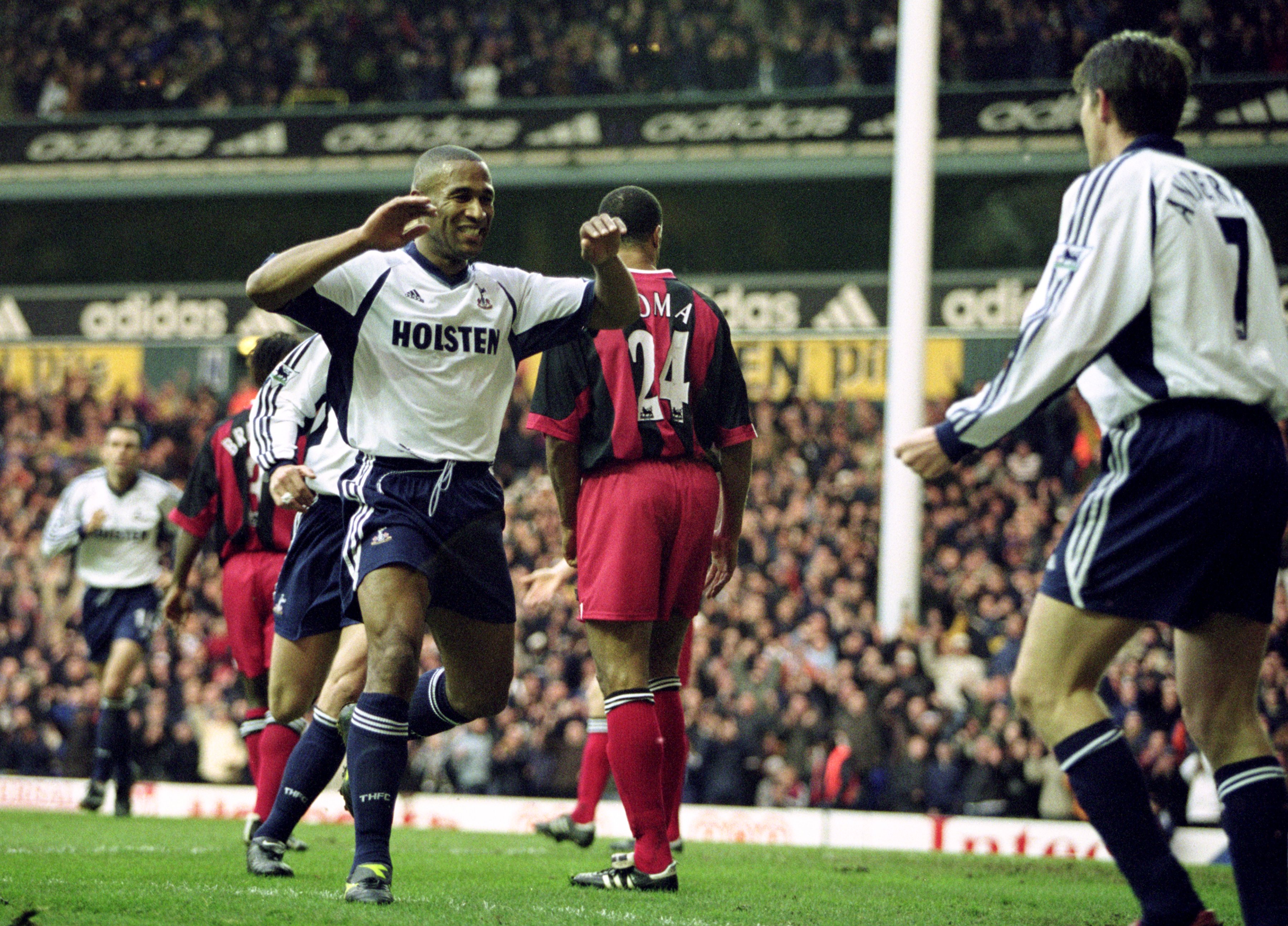 Les Ferdinand celebrates with Tottenham team-mate Darren Anderton after scoring the Premier League's 10,000th goal in a game against Fulham in December 2001.