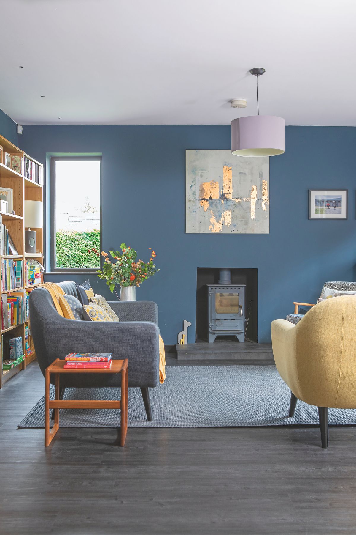renovated dark blue living room with stove