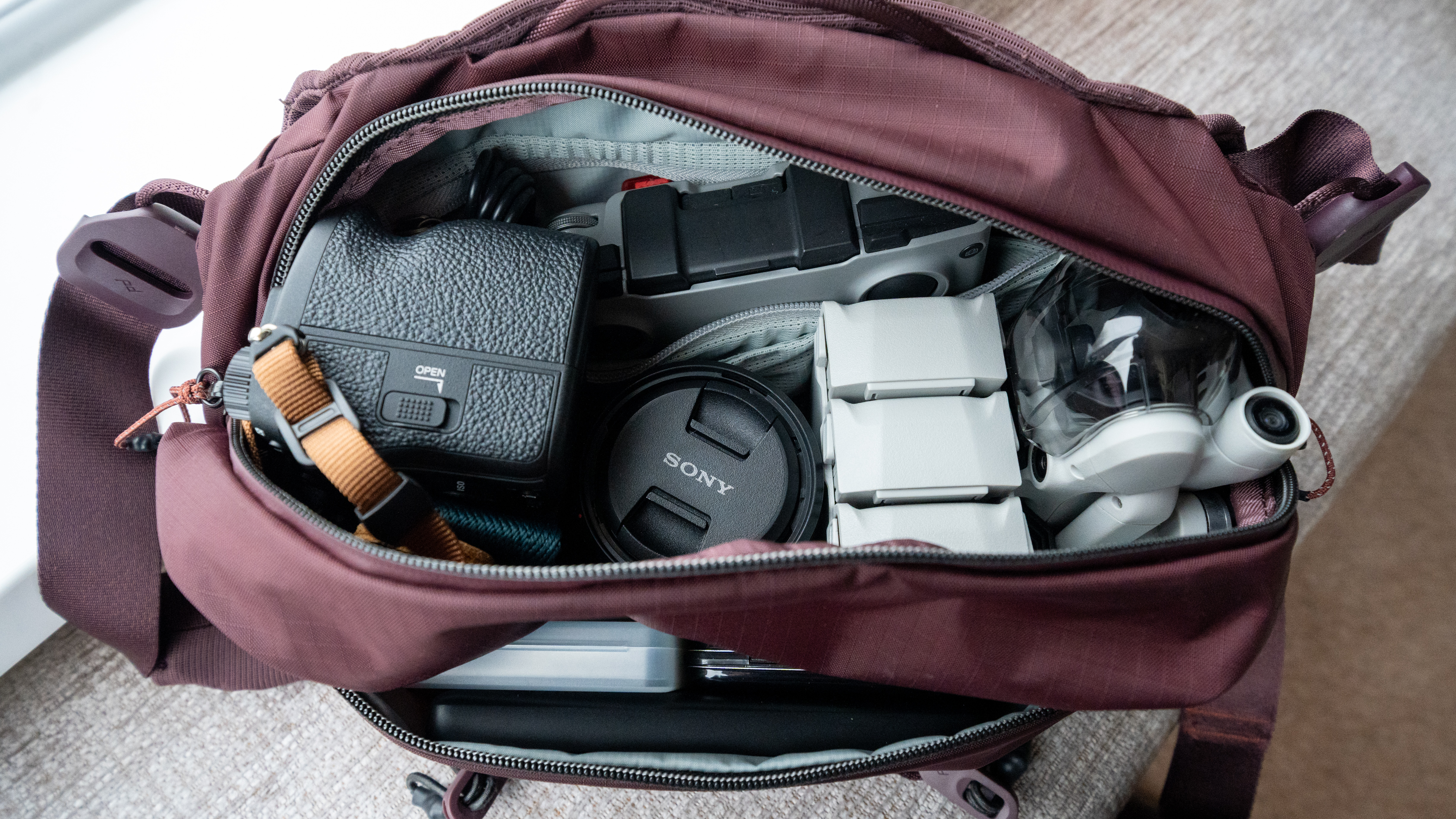 photography and drone equipment inside the peak design sling bag