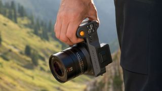 Hasselblad X2D II 100C being used by a photographer outdoors