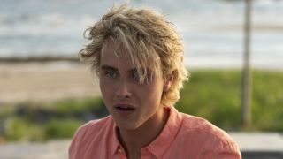 Joseph Zada looking shocked in We Were Liars while on the beach
