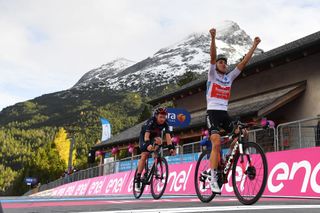 LAGHI DI CANCANO ITALY OCTOBER 22 Arrival Jai Hindley of Australia and Team Sunweb White Best Young Rider Jersey Celebration Tao Geoghegan Hart of The United Kingdom and Team INEOS Grenadiers during the 103rd Giro dItalia 2020 Stage 18 a 207km stage from Pinzolo to Laghi di Cancano Parco Nazionale dello Stelvio 1945m girodiitalia Giro on October 22 2020 in Laghi di Cancano Italy Photo by Stuart FranklinGetty Images