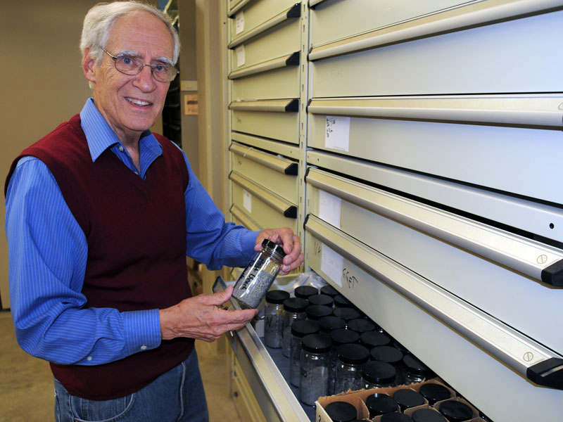 Earle McBride, above, one of the geologists to discover shrapnel and other microscopic relics from the D-Day invasion on Omaha Beach. He and colleague Dane Picard collected the sand sample in 1988.