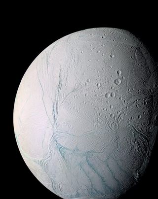 An enhanced-color view of the Saturn moon Enceladus captured by NASA’s Cassini spacecraft. This image shows the “tiger stripes” in the southern hemisphere from which Enceladus’ geysers erupt.