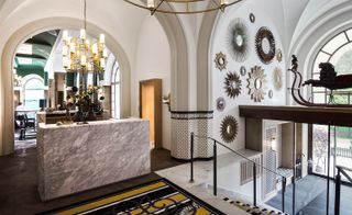 The reception area features a marble cube carved from a 20.5 tonne piece by sculptor and architect Veit Rausch