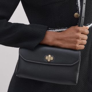 flat lay image of black clutch bag