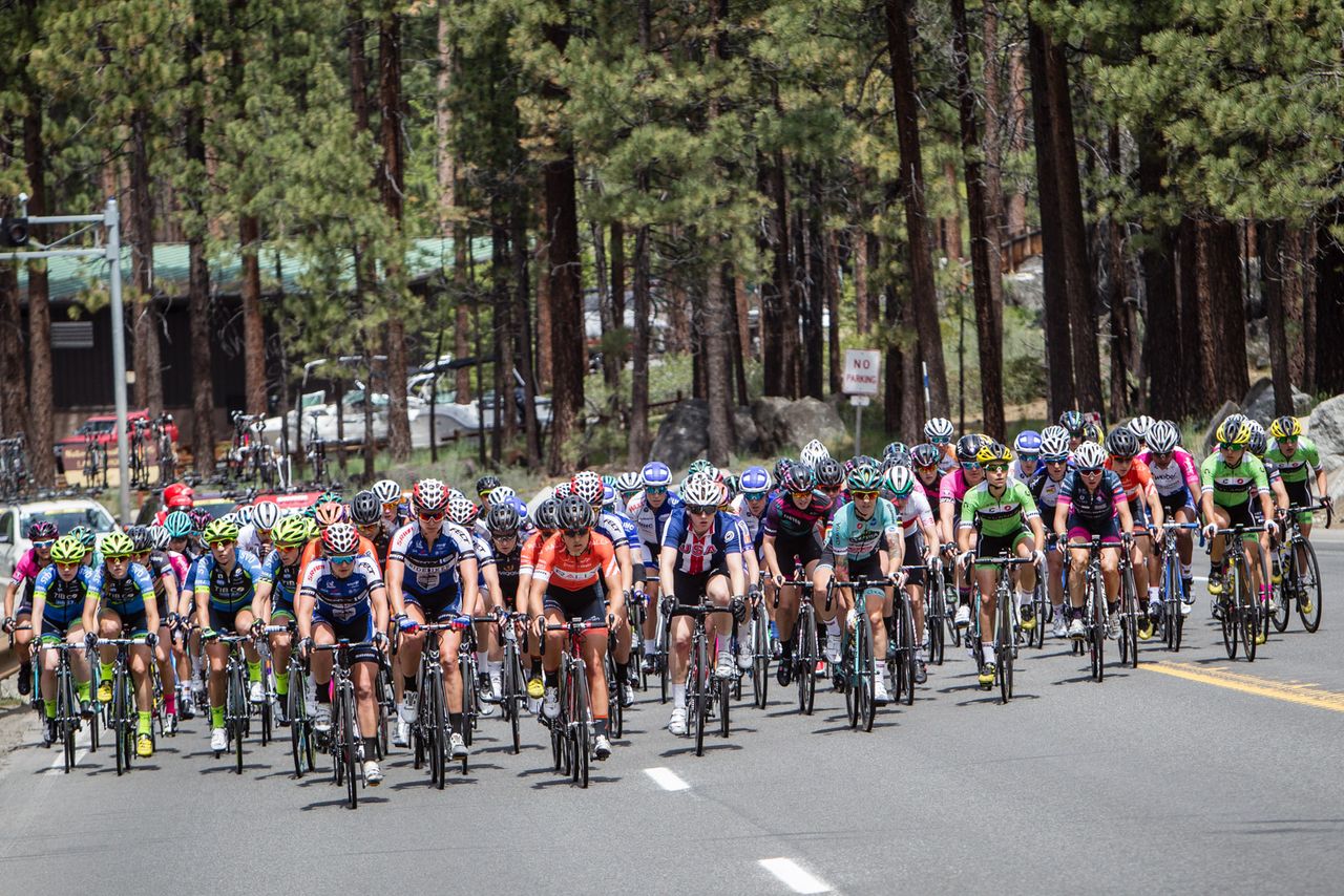 The women's field spreads across the road before taking up the chase