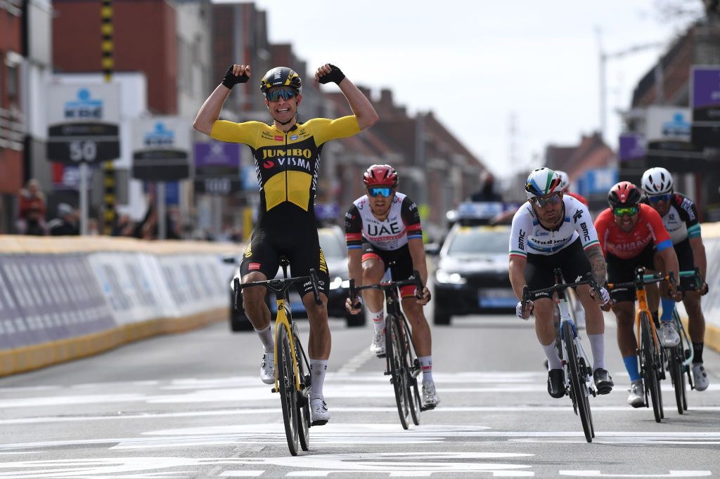 WEVELGEM BELGIUM MARCH 28 Arrival Wout Van Aert of Belgium and Team Jumbo Visma Celebration Giacomo Nizzolo of Italy and Team Qhubeka Assos Matteo Trentin of Italy and UAE Team Emirates Sonny Colbrelli of Italy and Team Bahrain Victorious Michael Matthews of Australia and Team Team BikeExchange during the 83rd GentWevelgem in Flanders Fields 2021 Mens Elite a 254km race from Ypres to Wevelgem GWE21 GWEmen FlandersClassic on March 28 2021 in Wevelgem Belgium Photo by Tim de WaeleGetty Images