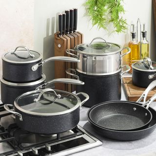 Set of matching granite pans in kitchen